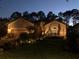 Charming home with a well-maintained lawn, garden, and exterior lighting for evening appeal at 9346 San Jose Blvd, Howey In The Hills, FL 34737