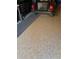 Garage floor with epoxy finish and a Yamaha golf cart at 9346 San Jose Blvd, Howey In The Hills, FL 34737