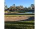 Picturesque golf course with green fairways, sand traps and water hazard at 9346 San Jose Blvd, Howey In The Hills, FL 34737
