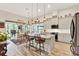 Spacious kitchen with a large island, pendant lighting, and an adjacent dining area at 9346 San Jose Blvd, Howey In The Hills, FL 34737