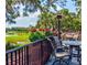 Inviting outdoor patio with comfortable seating, a view of the golf course, and beautiful landscaping at 9346 San Jose Blvd, Howey In The Hills, FL 34737