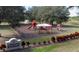 Community playground featuring a slide, swings, and picnic area, perfect for families at 9346 San Jose Blvd, Howey In The Hills, FL 34737