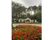 Beautifully landscaped entrance to Mission Inn Resort with vibrant flowers at 9346 San Jose Blvd, Howey In The Hills, FL 34737