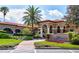 Spa Marbella entrance with lush landscaping and elegant architecture at 9346 San Jose Blvd, Howey In The Hills, FL 34737