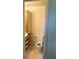 A half bathroom with wooden cabinets and a matching vanity at 1013 S Hiawassee Rd # 3626, Orlando, FL 32835