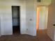 Neutral bedroom showcasing a walk-in closet and attached bathroom at 1013 S Hiawassee Rd # 3626, Orlando, FL 32835