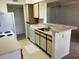 Kitchen view featuring bar top, white cabinets and appliances at 1013 S Hiawassee Rd # 3626, Orlando, FL 32835