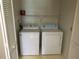 A laundry room with a washer, dryer, and wire rack at 1013 S Hiawassee Rd # 3626, Orlando, FL 32835
