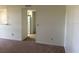 Cozy living room with neutral carpeting, clean white walls, and easy access to other areas at 1013 S Hiawassee Rd # 3626, Orlando, FL 32835
