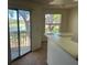 Sunlit living room featuring a sliding glass door with a view at 1013 S Hiawassee Rd # 3626, Orlando, FL 32835
