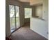 Bright living room with sliding glass door and window at 1013 S Hiawassee Rd # 3626, Orlando, FL 32835