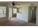 Living room with view of the balcony and adjacent kitchen at 1013 S Hiawassee Rd # 3626, Orlando, FL 32835