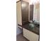 Bathroom featuring dual bowl sinks and a large cabinet at 1083 S Hiawassee Rd # 635, Orlando, FL 32835