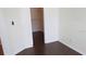 Bright, empty walk-in closet with dark hardwood floors, offering ample storage at 1083 S Hiawassee Rd # 635, Orlando, FL 32835