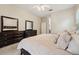 Bedroom with neutral tones, dark wood furniture, and ensuite bathroom at 1232 Scandia Ter, Oviedo, FL 32765