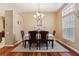 Cozy dining room with hardwood floors, elegant chandelier and comfortable seating at 1232 Scandia Ter, Oviedo, FL 32765