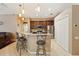 Well-lit kitchen with granite counters, stainless steel appliances, and pendant lighting at 1232 Scandia Ter, Oviedo, FL 32765