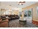Spacious living room with hardwood floors, comfortable seating, and sliding doors to the patio at 1232 Scandia Ter, Oviedo, FL 32765