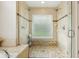 Walk-in shower with dual shower heads and clear glass enclosure at 1232 Scandia Ter, Oviedo, FL 32765