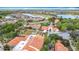 An aerial view shows the community clubhouse, pool, golf course, and the surrounding residential area at 124 Meridian Ave, Kissimmee, FL 34759