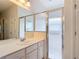 Bathroom featuring single sink vanity with cabinets and shower at 124 Meridian Ave, Kissimmee, FL 34759