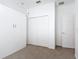 Bedroom featuring a built-in Murphy bed and carpeted flooring at 124 Meridian Ave, Kissimmee, FL 34759