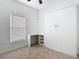 Bedroom featuring a built-in Murphy bed, desk, and carpeted flooring at 124 Meridian Ave, Kissimmee, FL 34759