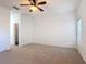 Spacious bedroom with neutral carpet, ample natural light and attached walk-in closet at 124 Meridian Ave, Kissimmee, FL 34759