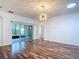 Bright living area featuring hardwood floors and sliding glass doors to the outdoor area at 124 Meridian Ave, Kissimmee, FL 34759