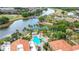 Aerial view of pool surrounded by palm trees and greenery, offering a relaxing oasis at 124 Meridian Ave, Kissimmee, FL 34759