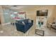 Open-concept living and dining area filled with natural light, featuring tile floors and neutral paint at 13440 Fordwell Dr, Orlando, FL 32828