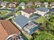 An aerial view that shows the screened in pool with seating and nice roof at 151 Castaway Beach Way, Kissimmee, FL 34746