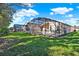 Spacious backyard featuring a large screened-in pool, perfect for outdoor relaxation and entertainment at 151 Castaway Beach Way, Kissimmee, FL 34746