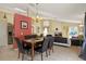 Open-concept dining room featuring tile floors, neutral colors, and an open layout for easy entertaining at 151 Castaway Beach Way, Kissimmee, FL 34746