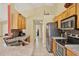 Functional kitchen with stainless steel appliances and solid-surface countertops at 151 Castaway Beach Way, Kissimmee, FL 34746