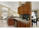 Well-equipped kitchen with stainless steel appliances, granite countertops, and ample cabinet space at 151 Castaway Beach Way, Kissimmee, FL 34746