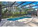 Screened pool with chairs and spa, beautiful backyard and lots of sunlight at 151 Castaway Beach Way, Kissimmee, FL 34746