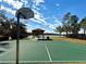 Community basketball court featuring a covered picnic area and picturesque lake views at 1552 Broken Oak Dr # B, Winter Garden, FL 34787