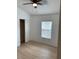 Bedroom with light walls, wood flooring, closet, ceiling fan, and a window at 1552 Broken Oak Dr # B, Winter Garden, FL 34787