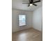 Inviting bedroom with light wood floors, a ceiling fan, and a bright window offering a comfortable retreat at 1552 Broken Oak Dr # B, Winter Garden, FL 34787