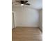 Neutral bedroom with ceiling fan, natural light, and wood floors at 1552 Broken Oak Dr # B, Winter Garden, FL 34787