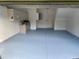 This garage boasts epoxy floors, ample storage, and a convenient interior door at 1552 Broken Oak Dr # B, Winter Garden, FL 34787