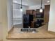 Kitchen featuring a sink, black appliances and wooden cabinetry at 1552 Broken Oak Dr # B, Winter Garden, FL 34787