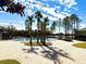 Community pool featuring palm trees and plenty of lounge chairs for relaxing at 1552 Broken Oak Dr # B, Winter Garden, FL 34787