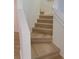 Staircase with light wood treads, white risers, and a matching handrail at 1552 Broken Oak Dr # B, Winter Garden, FL 34787