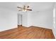 Bedroom with hardwood flooring, ceiling fan and a bright window with natural light at 1725 Marcia Dr, Orlando, FL 32807