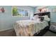 Bedroom with a large window and stylish decor at 1725 Marcia Dr, Orlando, FL 32807