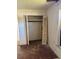 Bedroom features closet with louvered door, damaged wall, and distressed hardwood floors at 1811 S Westmoreland Dr, Orlando, FL 32805