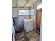 Laundry area with washer, water heater and exterior access at 1811 S Westmoreland Dr, Orlando, FL 32805