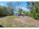 Large backyard featuring a storage shed and fire pit at 1815 6Th Se St, Winter Haven, FL 33880